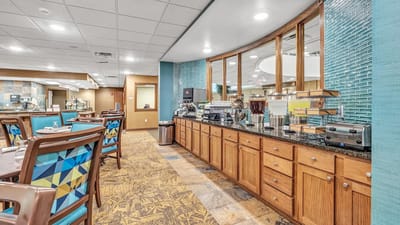 Interior dining area with beverage station and tables