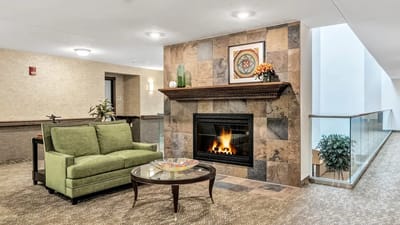 Cozy lobby area with fireplace and seating
