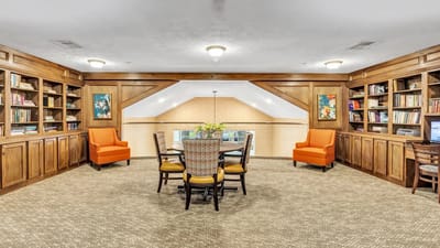 Bright common area with seating and bookshelves