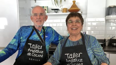 Two residents smiling in a kitchen setting