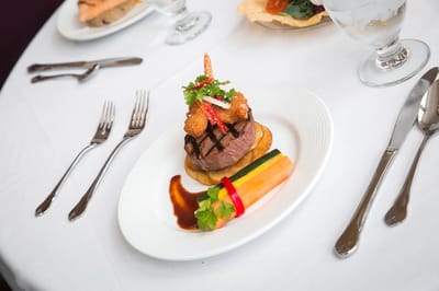 A beautifully plated gourmet meal with vegetables