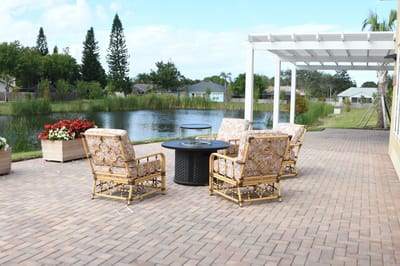 Outdoor seating area by a serene pond