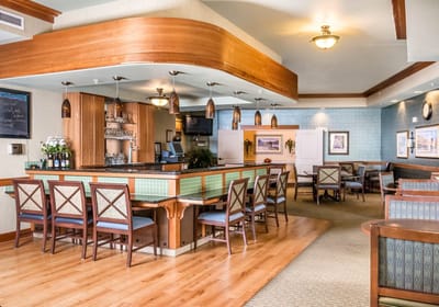 Bright common area with a bar and seating