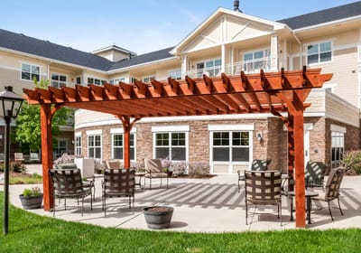 Outdoor patio area with seating and a pergola