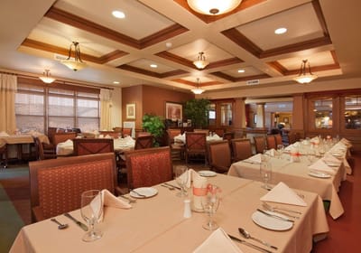 Dining area with neatly set tables and decor