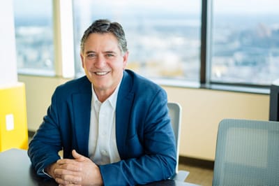 Professional man smiling in an office environment