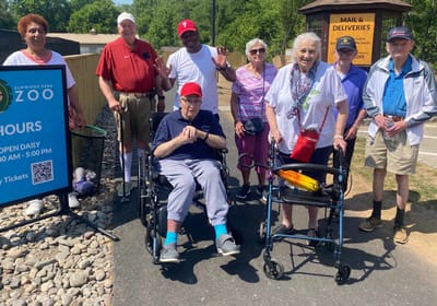 Residents enjoying time outdoors at a facility event