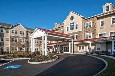 Building exterior with entrance and parking area