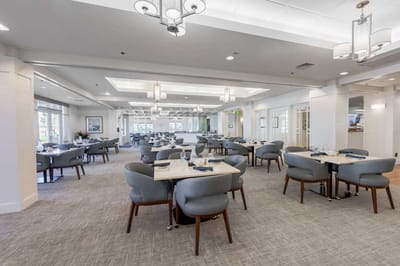 Bright dining room with tables set for meals