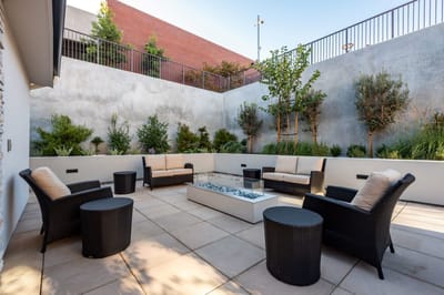 Outdoor seating area with plants and seating