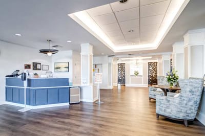 Interior lobby area with seating and reception desk