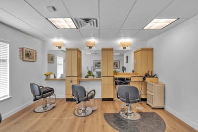 Well-lit interior of a hair salon in the facility