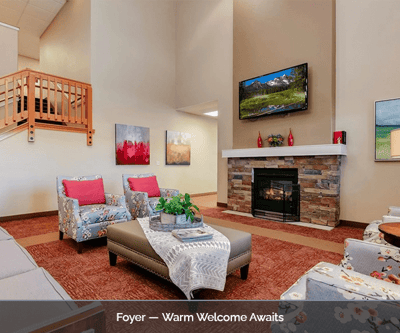 Cozy foyer with seating area and fireplace