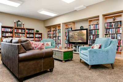 Interior common area with bookshelves and seating