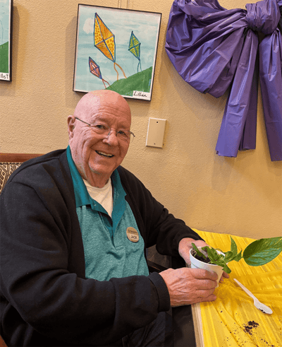 Resident engaging in a planting activity indoors
