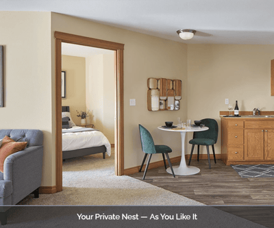 Interior view of a private resident room with kitchenette