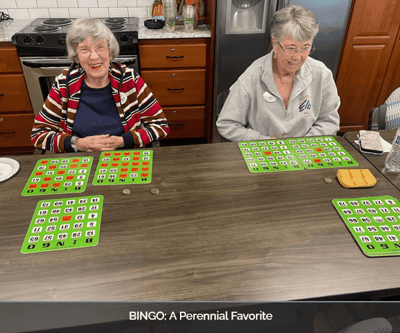 Residents enjoying a game of bingo at a table