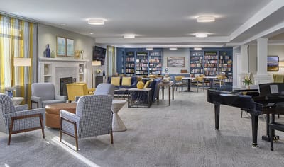 Bright common area with seating and bookshelves