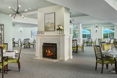 Interior dining area with fireplace and decorated tables