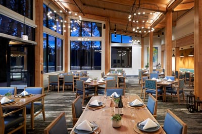 Bright dining room setup with tables and chairs