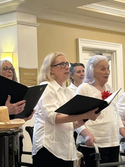 Residents singing together in a common area