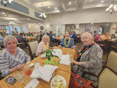 Residents enjoying a meal together in a common area