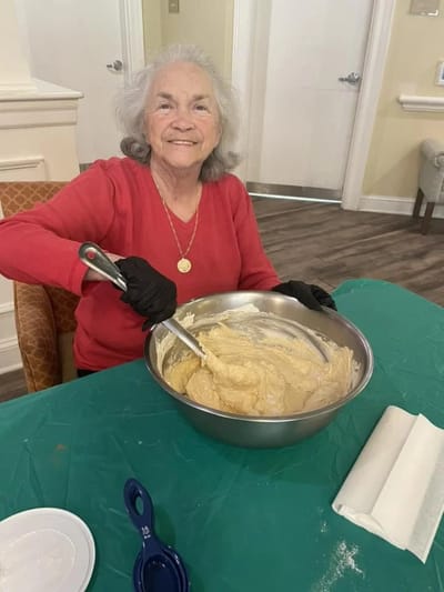 Senior resident baking in a common area