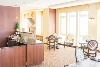 Dining area with tables and chairs, well-lit space