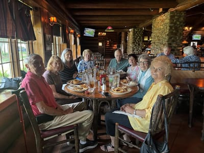 Residents enjoying a meal together at a dining table