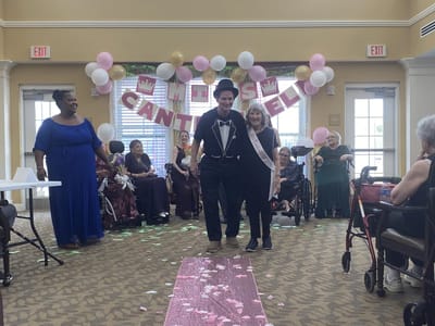 Residents celebrating a pageant event in a common area