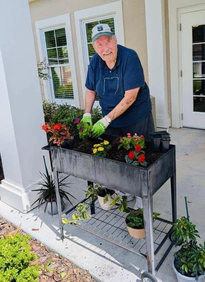 Resident gardening outside a facility