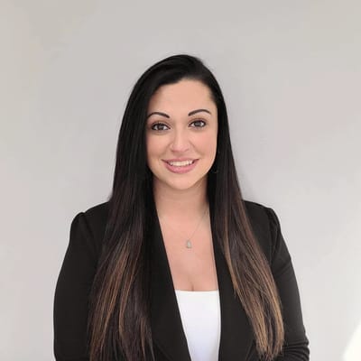 Portrait of a staff member with long dark hair