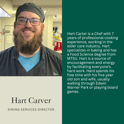 Hart Carver, Dining Services Director, smiling in the kitchen.