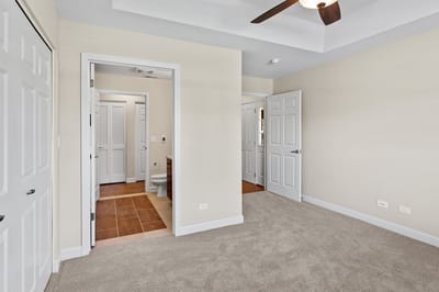 Interior view of a resident room with carpet and doorways