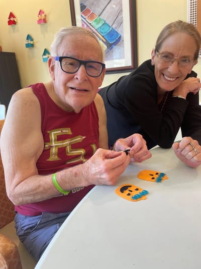 Residents engaged in a crafting activity indoors