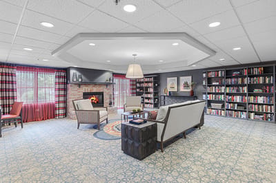 Interior common area with seating and bookshelves