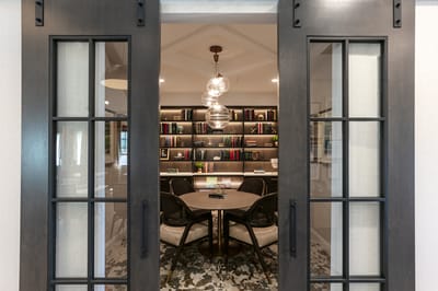 Interior view of a cozy reading room with bookshelves