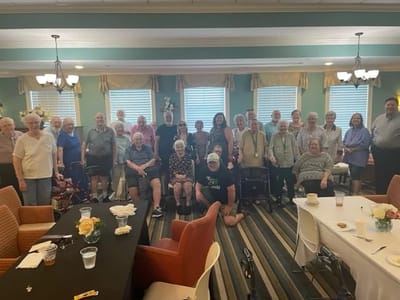 Residents and staff gathered in a common area