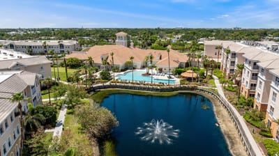 Aerial view of Aston Gardens with pool and lake