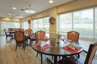 Dining area with well-set tables and decorations