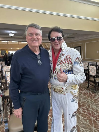 Residents enjoying an Elvis performance at the facility