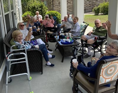Residents enjoying a sunny outdoor gathering