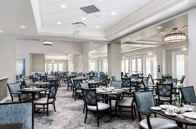 Bright dining room with neatly arranged tables and chairs