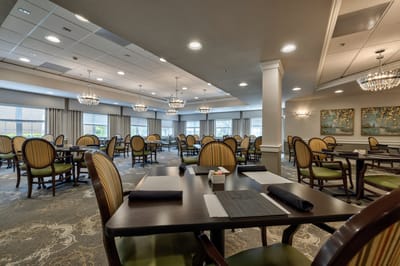 Elegant dining room with decorative lighting and tables