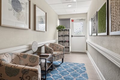 Bright and welcoming interior corridor with seating