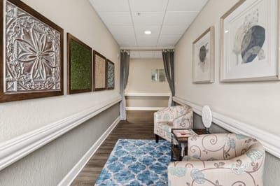 Bright hallway with comfortable seating and decor