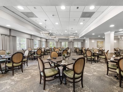 Dining room with tables and chairs set for meals