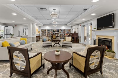 Bright common area with seating and bookshelves
