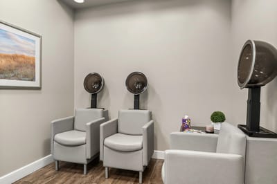 Interior salon area with hair dryers