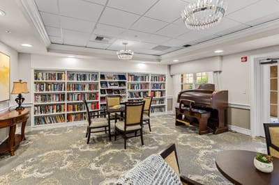 Interior of a cozy library with bookshelves and seating